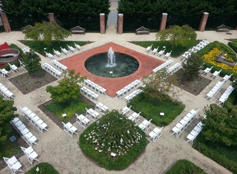 Moxley gardens set with chairs surrounding fountain