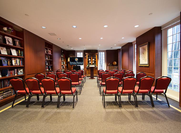 Library set theater style with red and black conference chairs