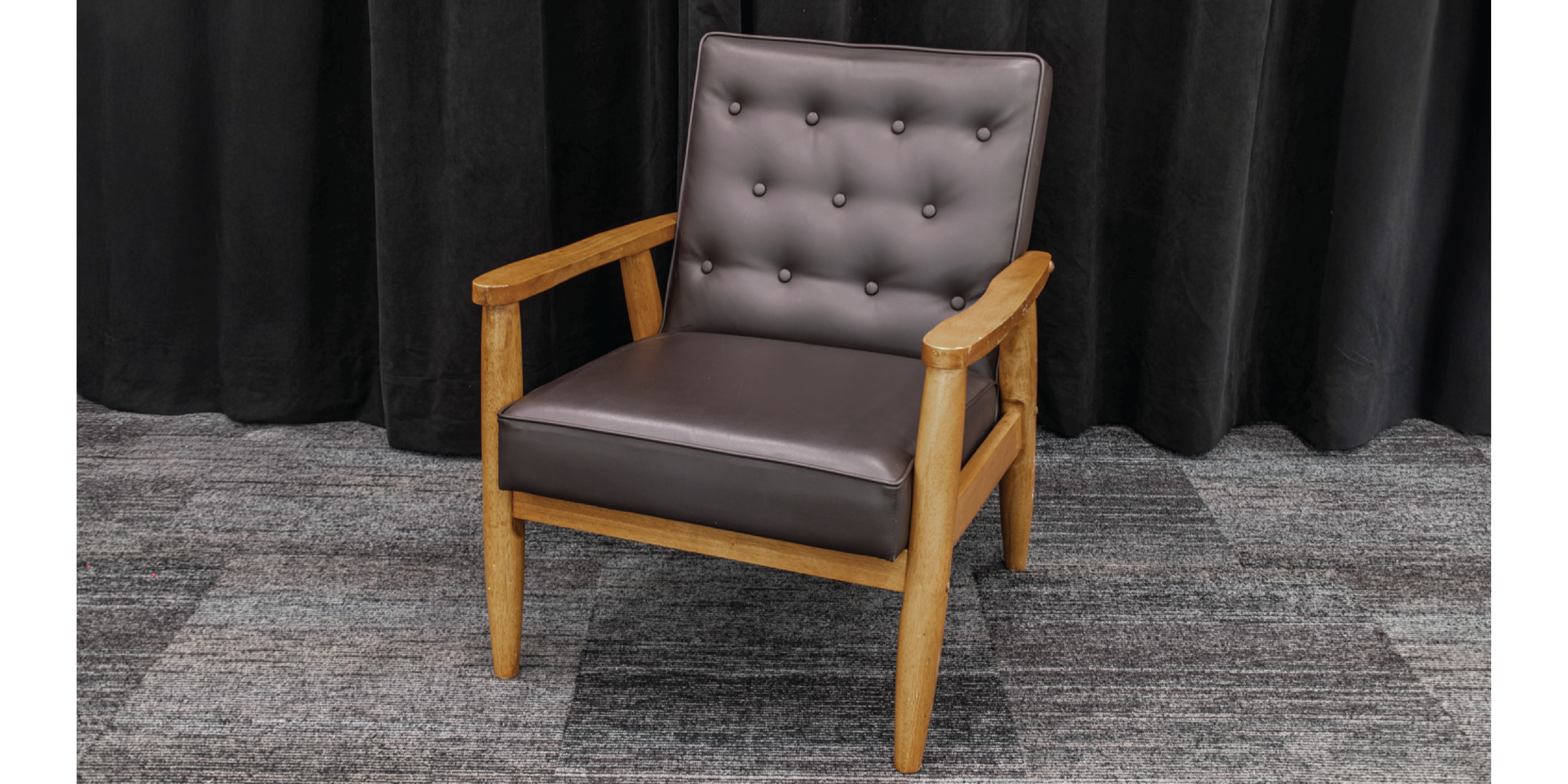 Black Leather chair with wooden arms and legs.