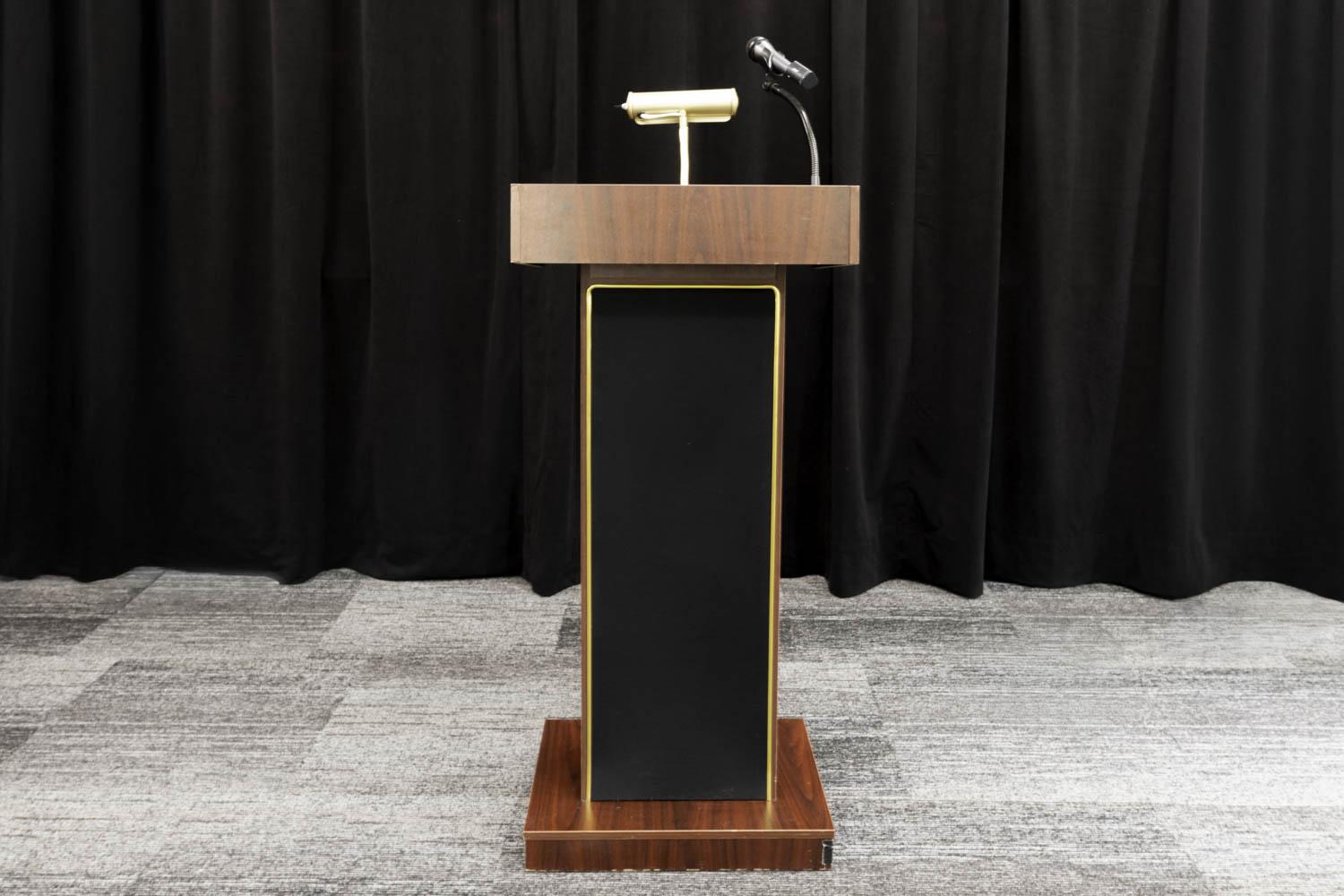 Wooden Podium with Gold light attachment and a mic holder. 
