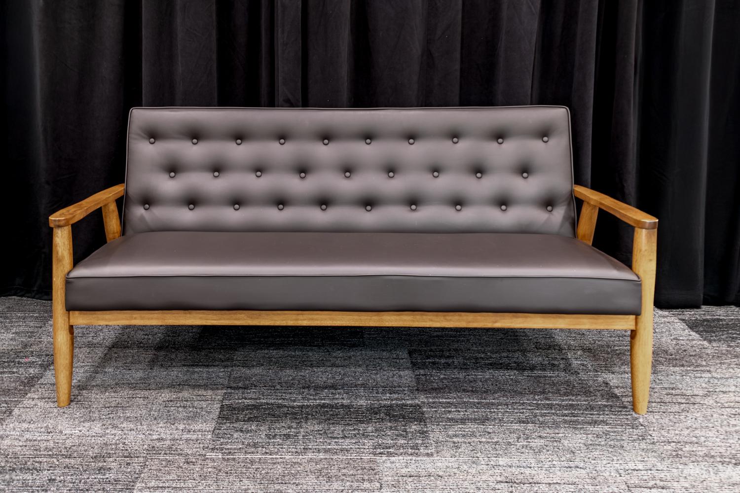 Black Leather couch with wooden arms and legs.
